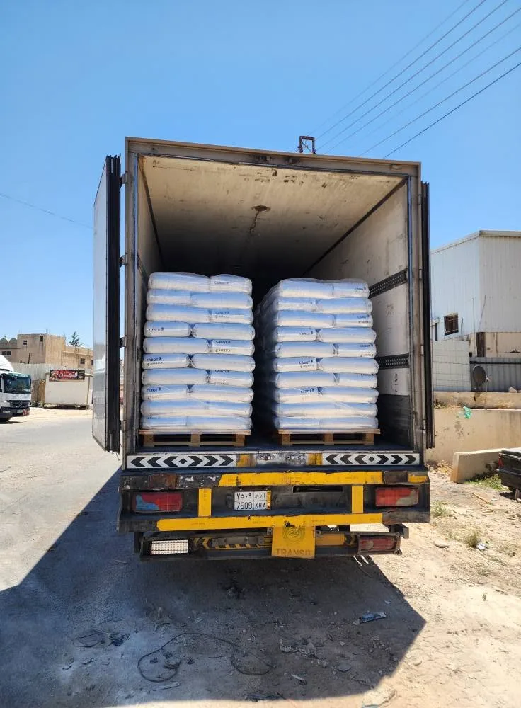 Truck loaded with stacked bags of masterbatch